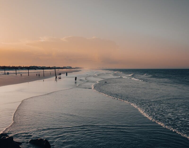 Beach Scenery - A peaceful sunset at a sandy beach with gentle w #12951940