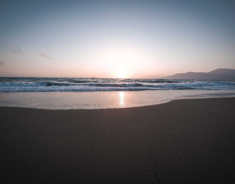 Beach Scenery - Beautiful sunset over a tranquil beach with gent #13335454