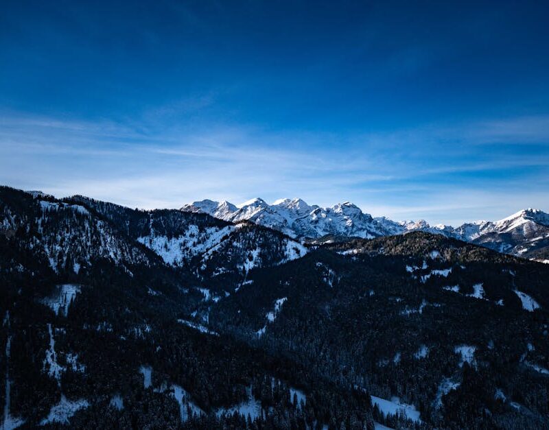 Mountain Landscapes - A stunning view of snow-covered mountain peaks u #19868383