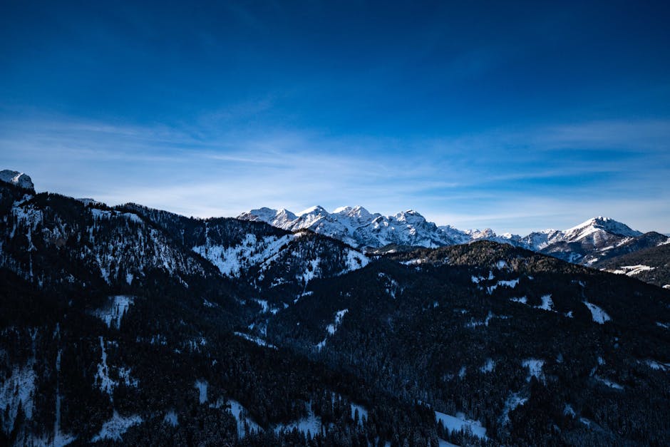 Mountain Landscapes - A stunning view of snow-covered mountain peaks u #19868383