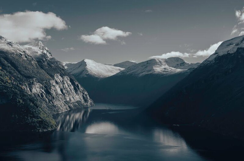 Mountain Landscapes - Beautiful view of a Norwegian fjord surrounded b #32574837