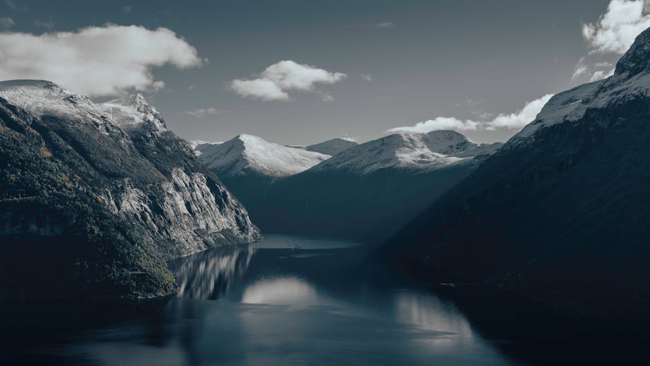 Mountain Landscapes - Beautiful view of a Norwegian fjord surrounded b #32574837