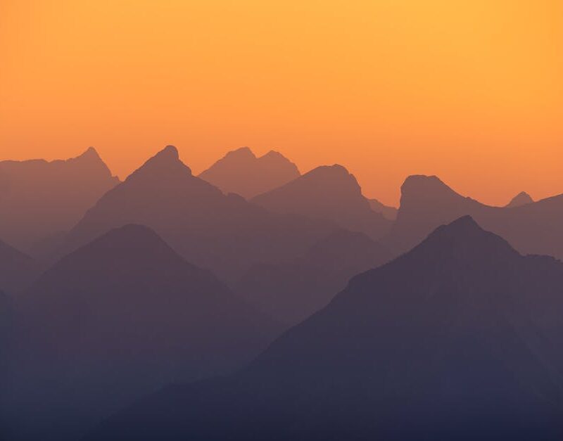 Mountain Landscapes - Beautiful silhouette of the Austrian Alps at sun #33670090