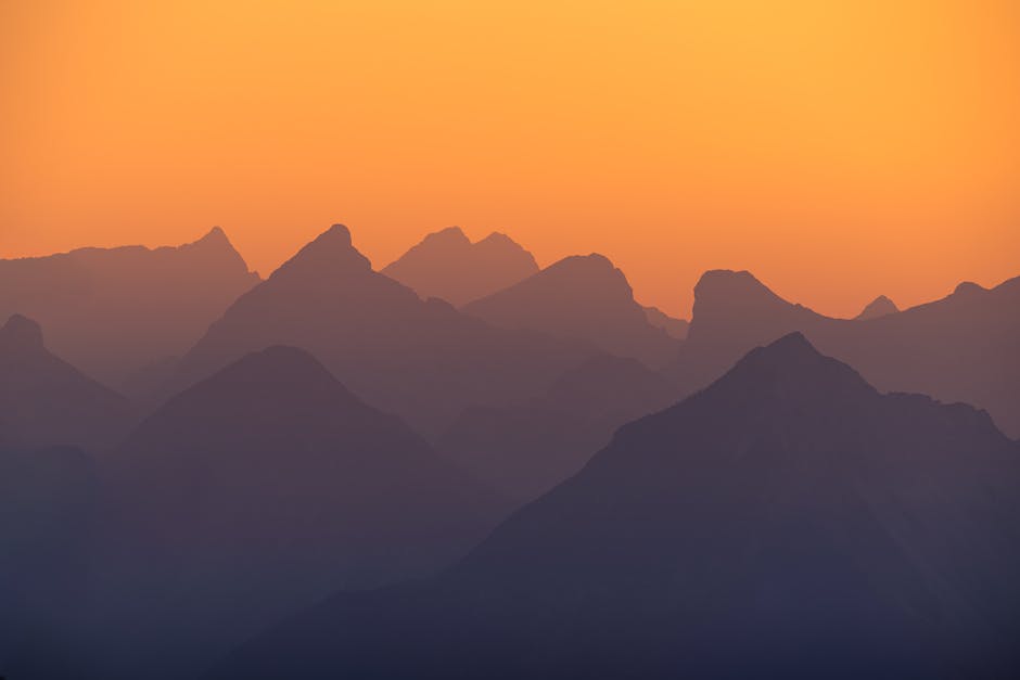 Mountain Landscapes - Beautiful silhouette of the Austrian Alps at sun #33670090