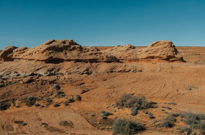 Desert Wilderness - Scenic view of red rock formations under a clear #34933154
