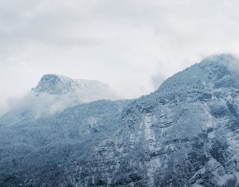 Snow Mountains - A captivating view of snow-covered mountains wit #35019313