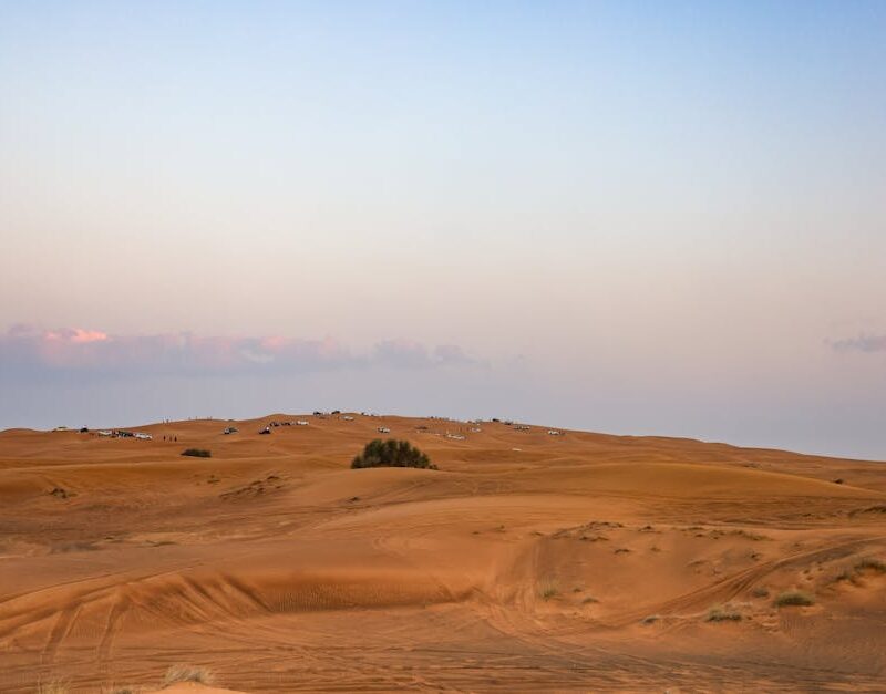 Desert Wilderness - A scenic view of a desert landscape at sunset wi #35112813