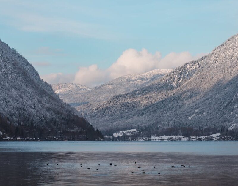 Lake Reflections - Serene winter landscape of a snow-covered mounta #35224233