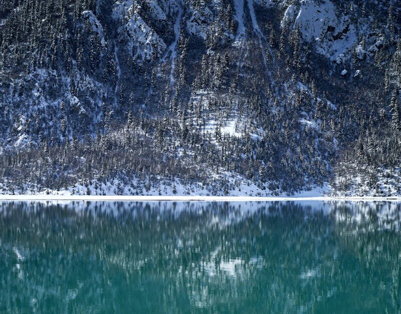 Lake Reflections - Serene winter landscape with snow-laden mountain #35352506