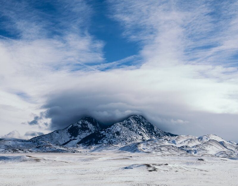 Snow Mountains - Majestic snow-covered mountains beneath a dramat #3555762