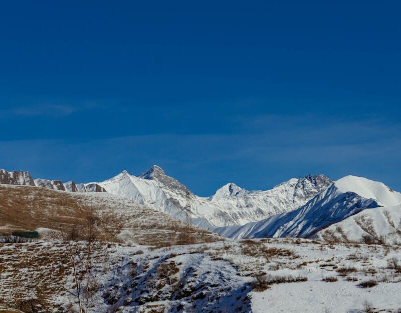 Snow Mountains - Scenic view of snowy mountains and blue sky, ide #36028834