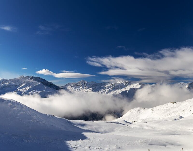 Snow Mountains - Snow-covered peaks and dramatic clouds create a #36524761