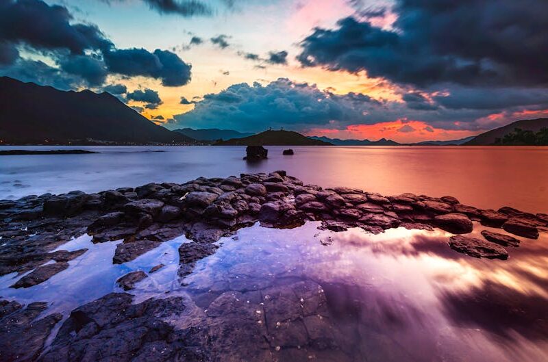 Lake Reflections - A breathtaking view of a sunset reflecting over  #4700630