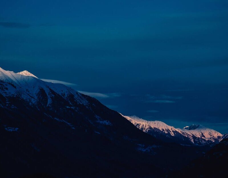 Snow Mountains - Snow-capped mountains under a twilight sky, offe #6407611